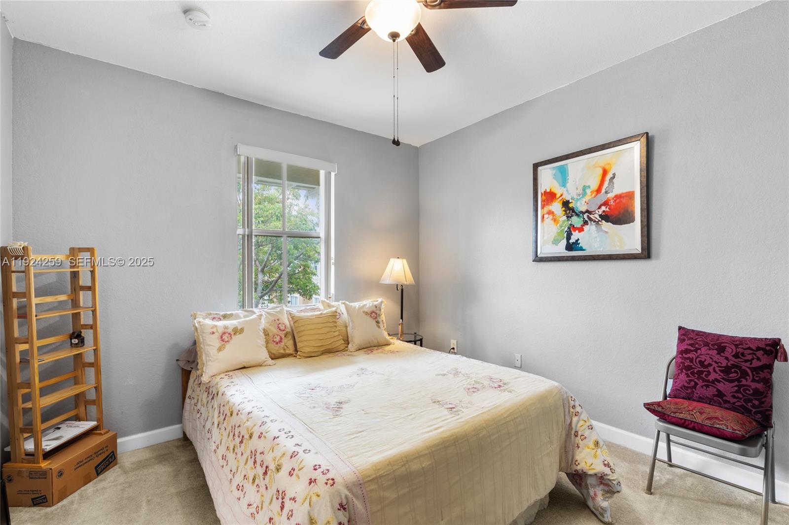 230 Southeast 29th Avenue, Unit 12 Homestead, FL 33033 - Photo 16 of 29 a bedroom with a bed and a couch