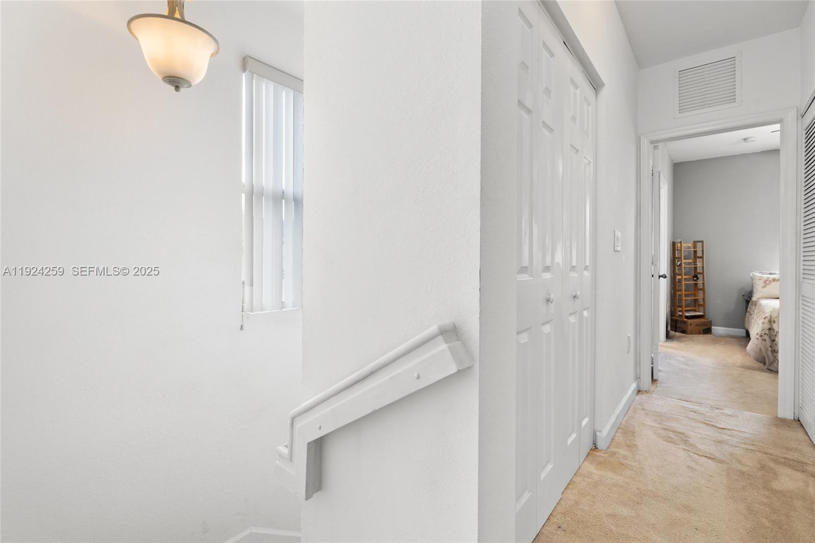 230 Southeast 29th Avenue, Unit 12 Homestead, FL 33033 - Photo 19 of 29 a view of a room with wooden floor and bathroom view