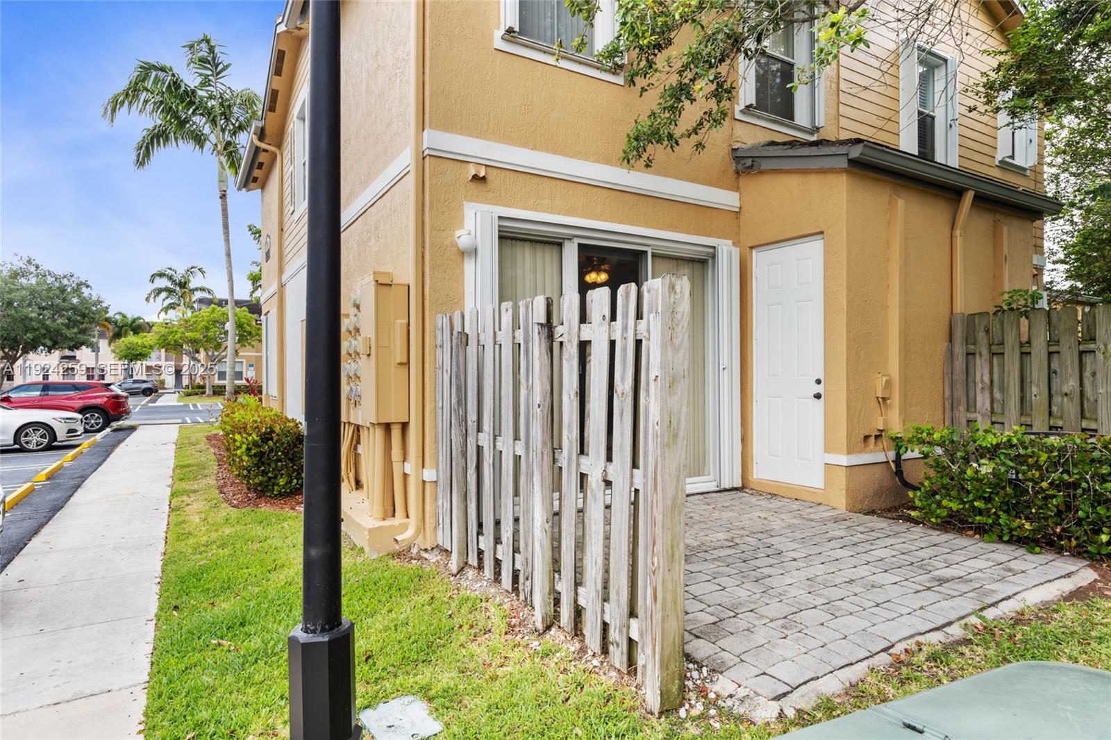 230 Southeast 29th Avenue, Unit 12 Homestead, FL 33033 - Photo 23 of 29 a front view of a house with a porch