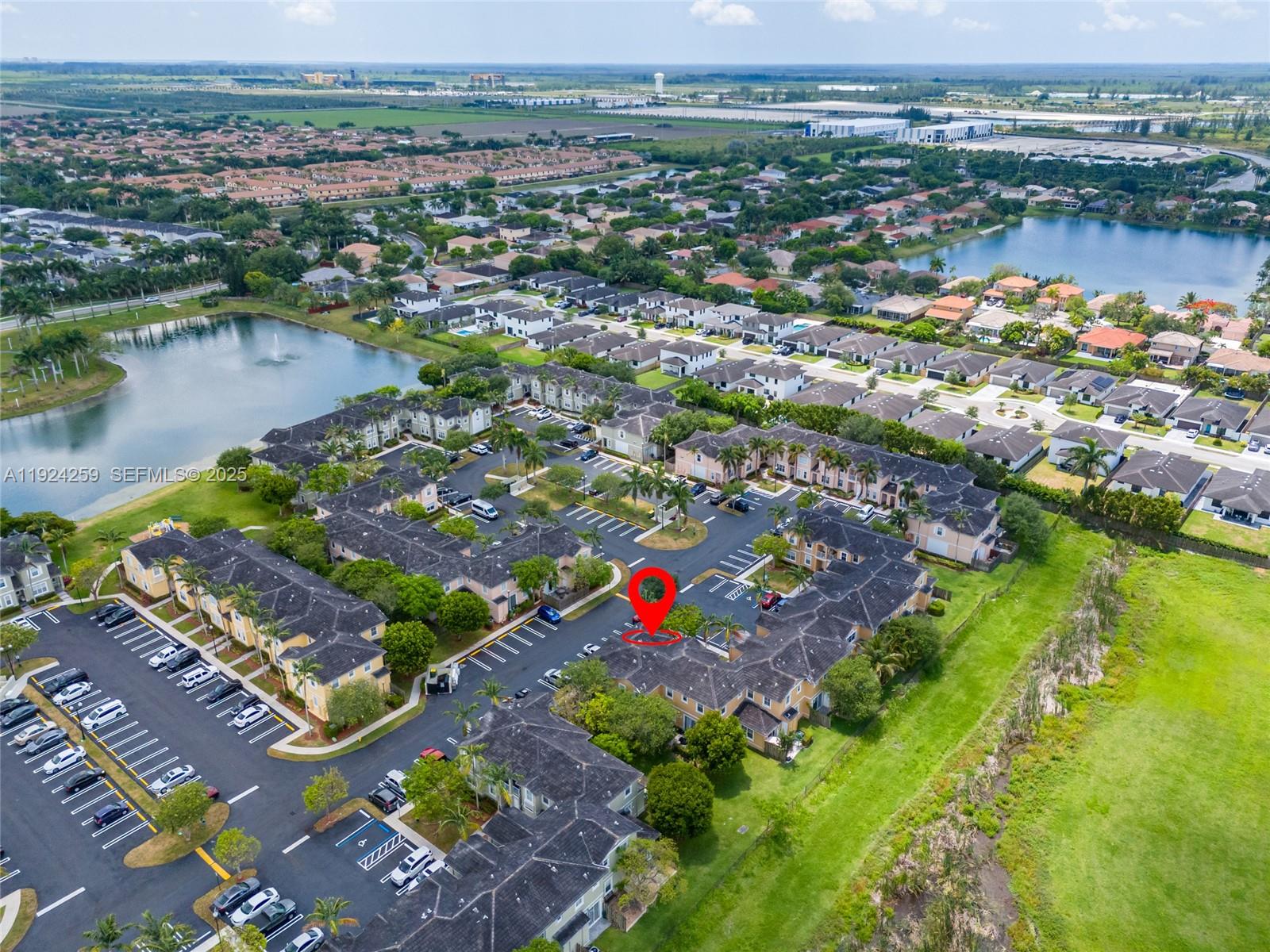 230 Southeast 29th Avenue, Unit 12 Homestead, FL 33033 - Photo 29 of 29 an aerial view of city and lake with trees all around