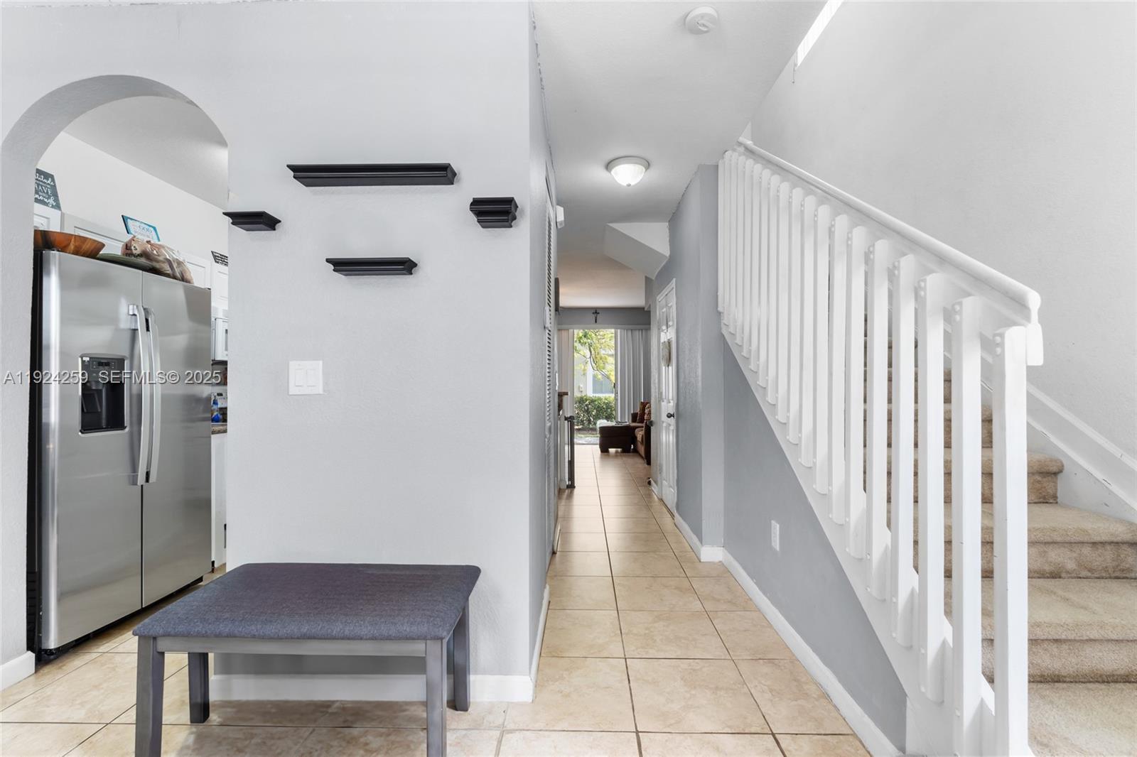230 Southeast 29th Avenue, Unit 12 Homestead, FL 33033 - Photo 5 of 29 a view of a hallway with seating area