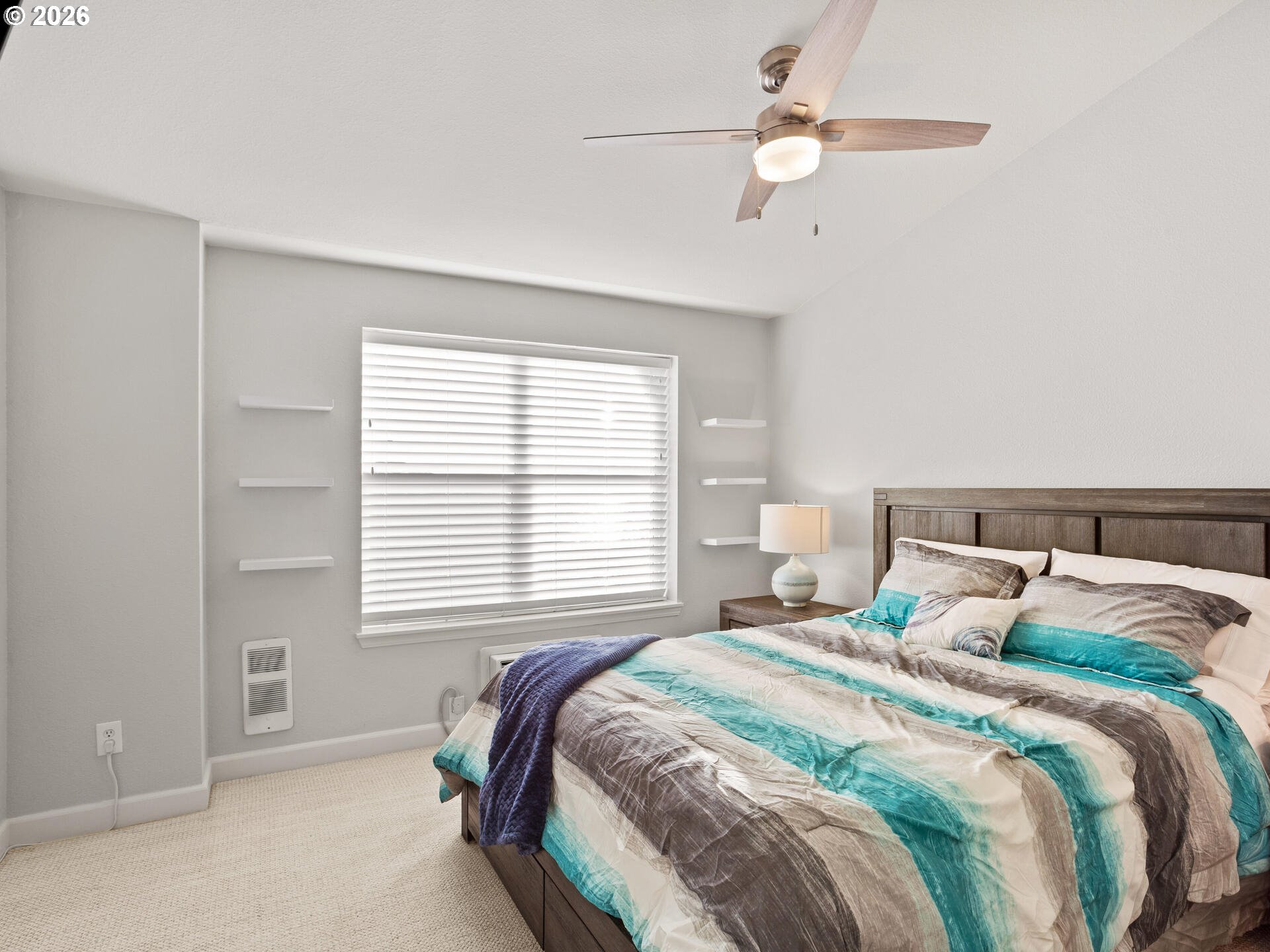 758 Southeast Fairwinds Loop Vancouver, WA 98661 - Photo 13 of 30 a bedroom with a bed and a chandelier