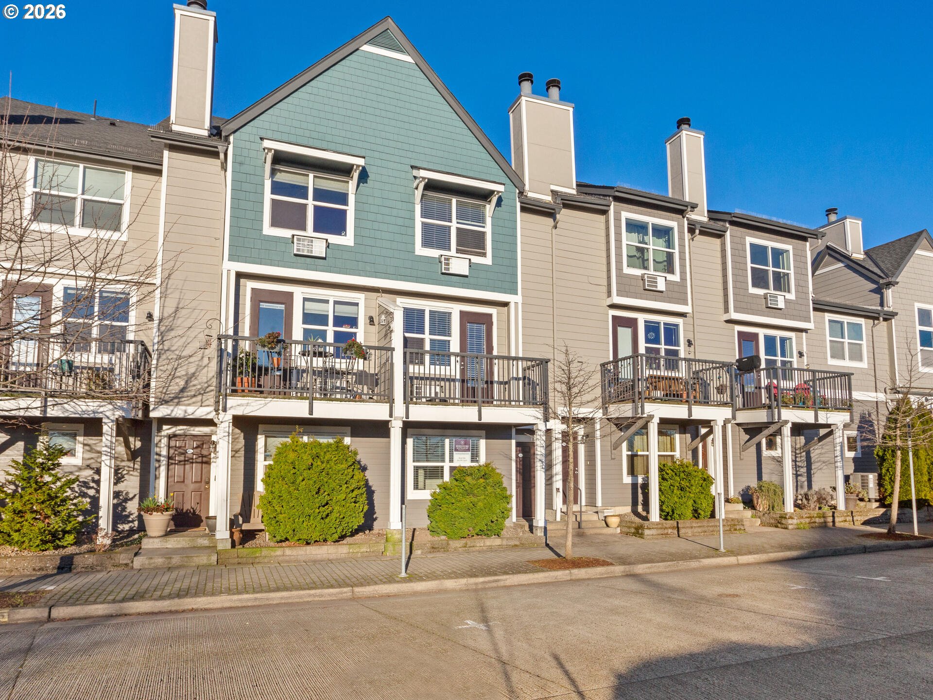 758 Southeast Fairwinds Loop Vancouver, WA 98661 - Photo 2 of 30 a front view of a building with a garden and plants