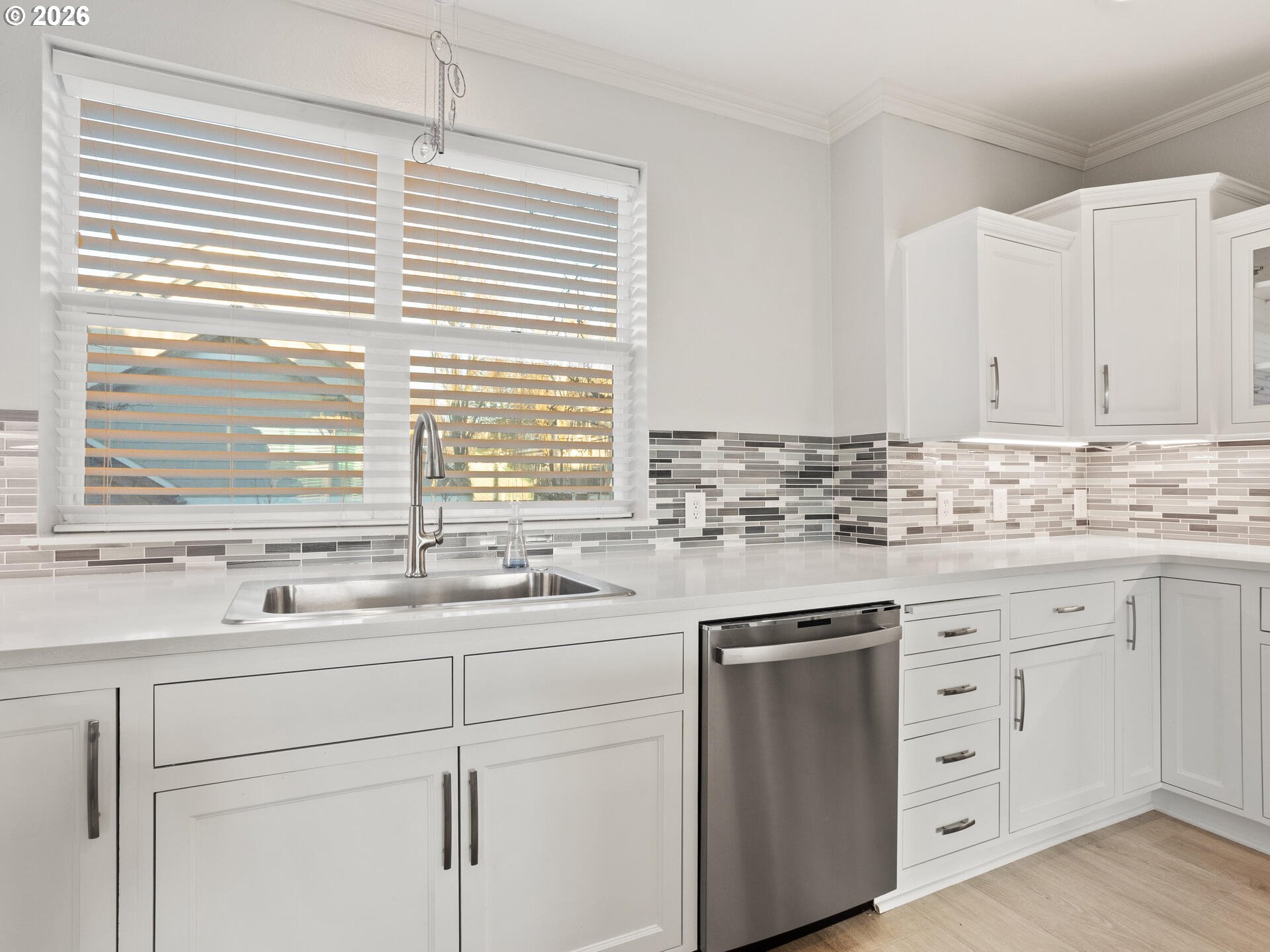 758 Southeast Fairwinds Loop Vancouver, WA 98661 - Photo 7 of 30 a kitchen with white cabinets and white appliances