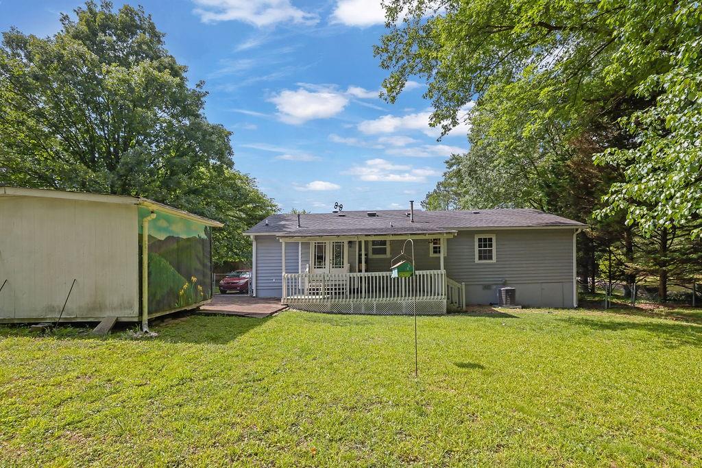 1555 Rock Springs Road Buford, GA 30519 - Photo 25 of 27 a view of a house with a yard and sitting area