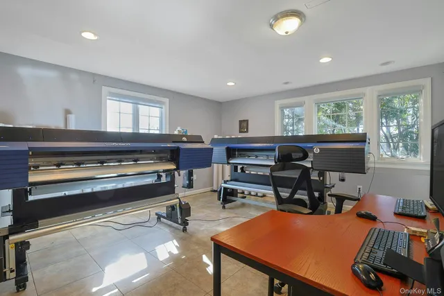 a bathroom with a sink a mirror a toilet and a shower