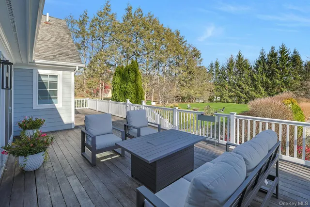 a view of a patio with iron fence