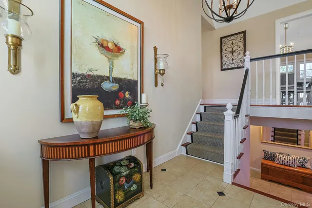 a view of hall way with furniture