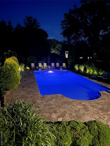 a view of backyard with wooden fence