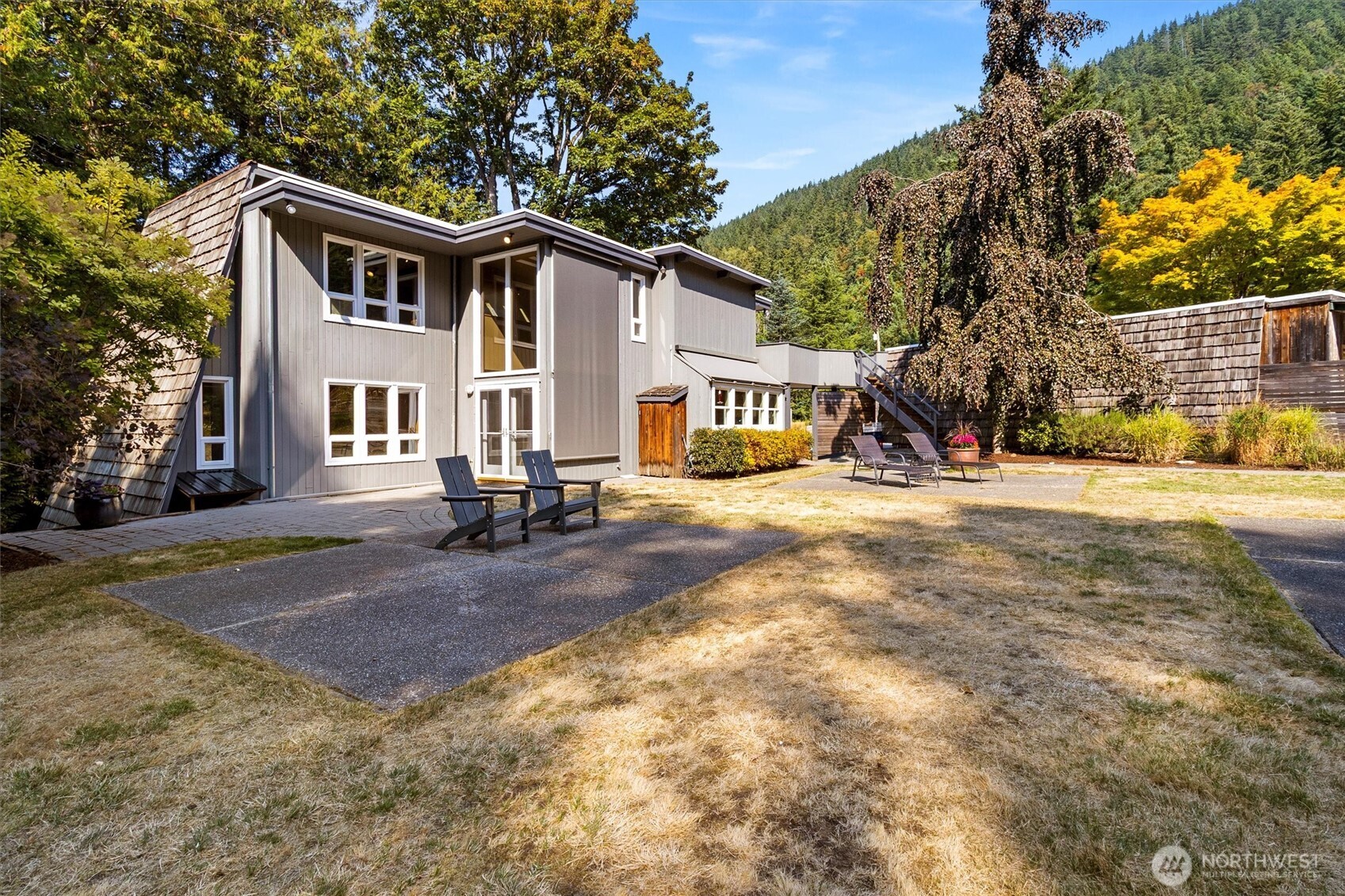123 Hiline Road Bellingham, WA 98229 - Photo 35 of 40 a view of a white house with a big yard and large trees
