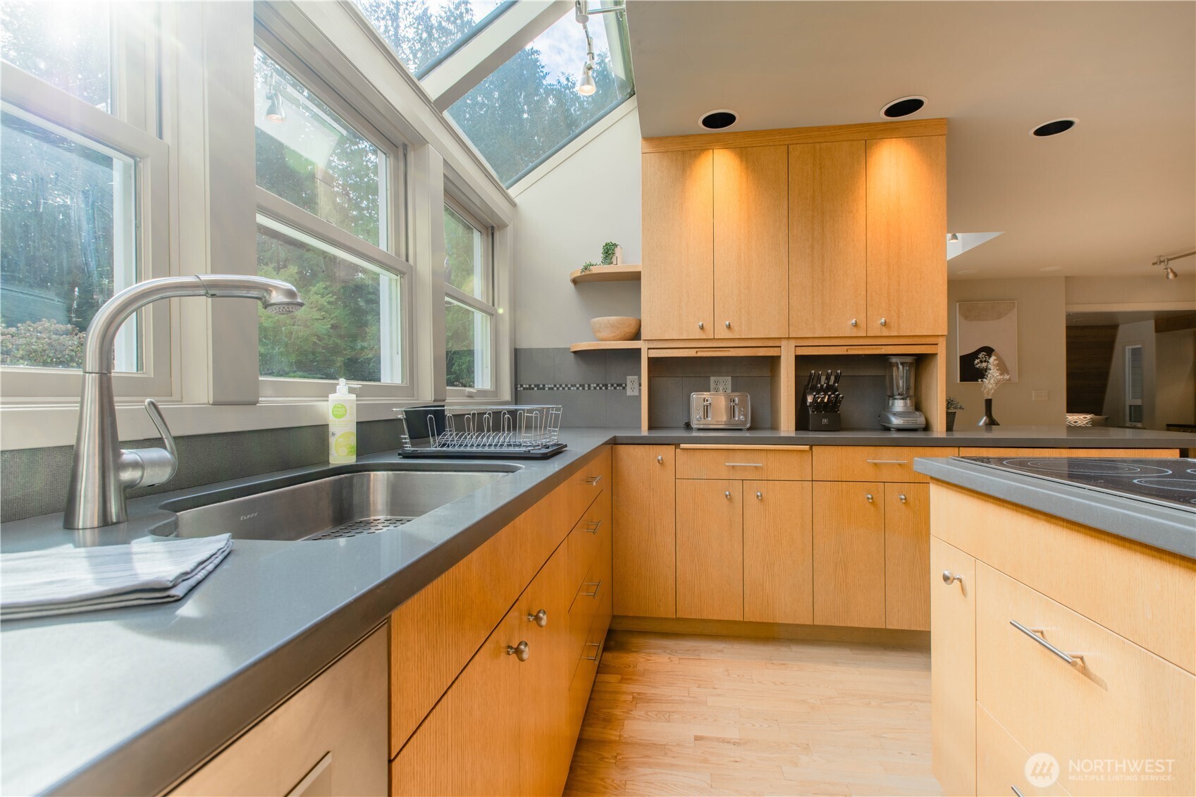 123 Hiline Road Bellingham, WA 98229 - Photo 5 of 40 a kitchen with stainless steel appliances granite countertop a sink and a wooden cabinets