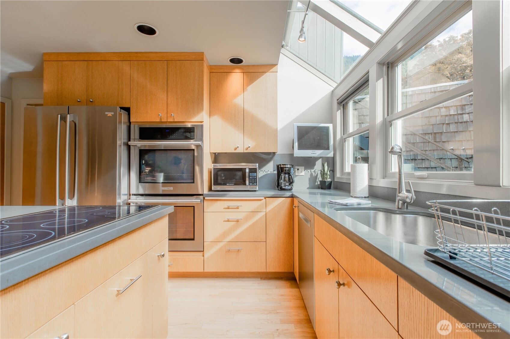 123 Hiline Road Bellingham, WA 98229 - Photo 6 of 40 a large kitchen with granite countertop a sink and a refrigerator