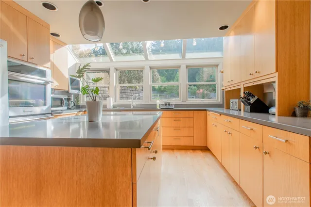 a view of a kitchen with a large window