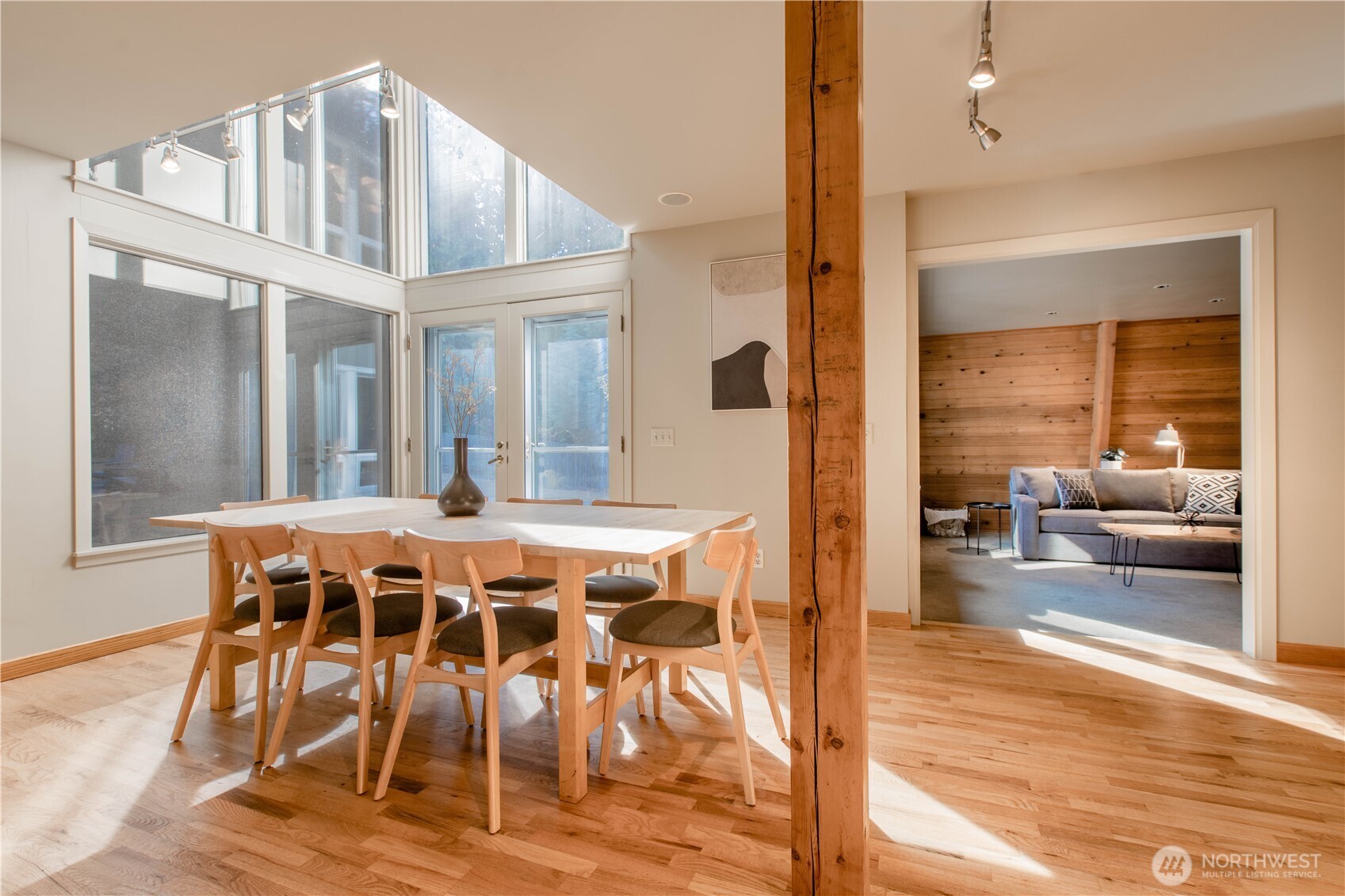 123 Hiline Road Bellingham, WA 98229 - Photo 9 of 40 a view of a dining room with furniture wooden floor and a chandelier