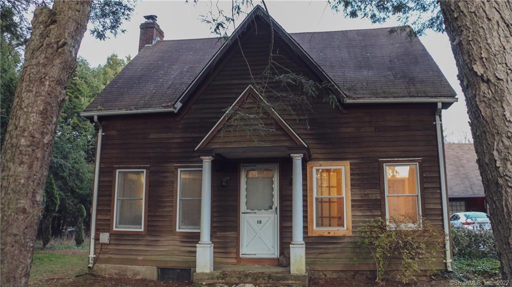 front view of a house with a small deck
