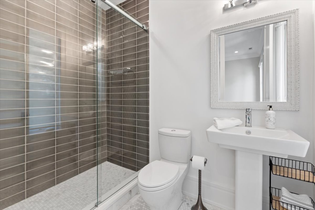 2138 North Seminary Avenue Chicago, IL 60614 - Photo 27 of 76 a bathroom with a toilet a sink and mirror