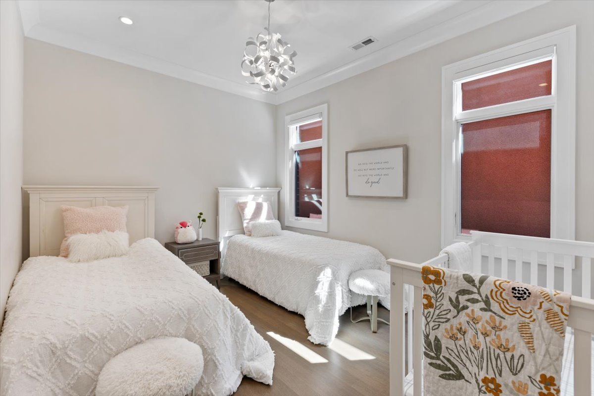 2138 North Seminary Avenue Chicago, IL 60614 - Photo 28 of 76 a bedroom with two beds and a chandelier