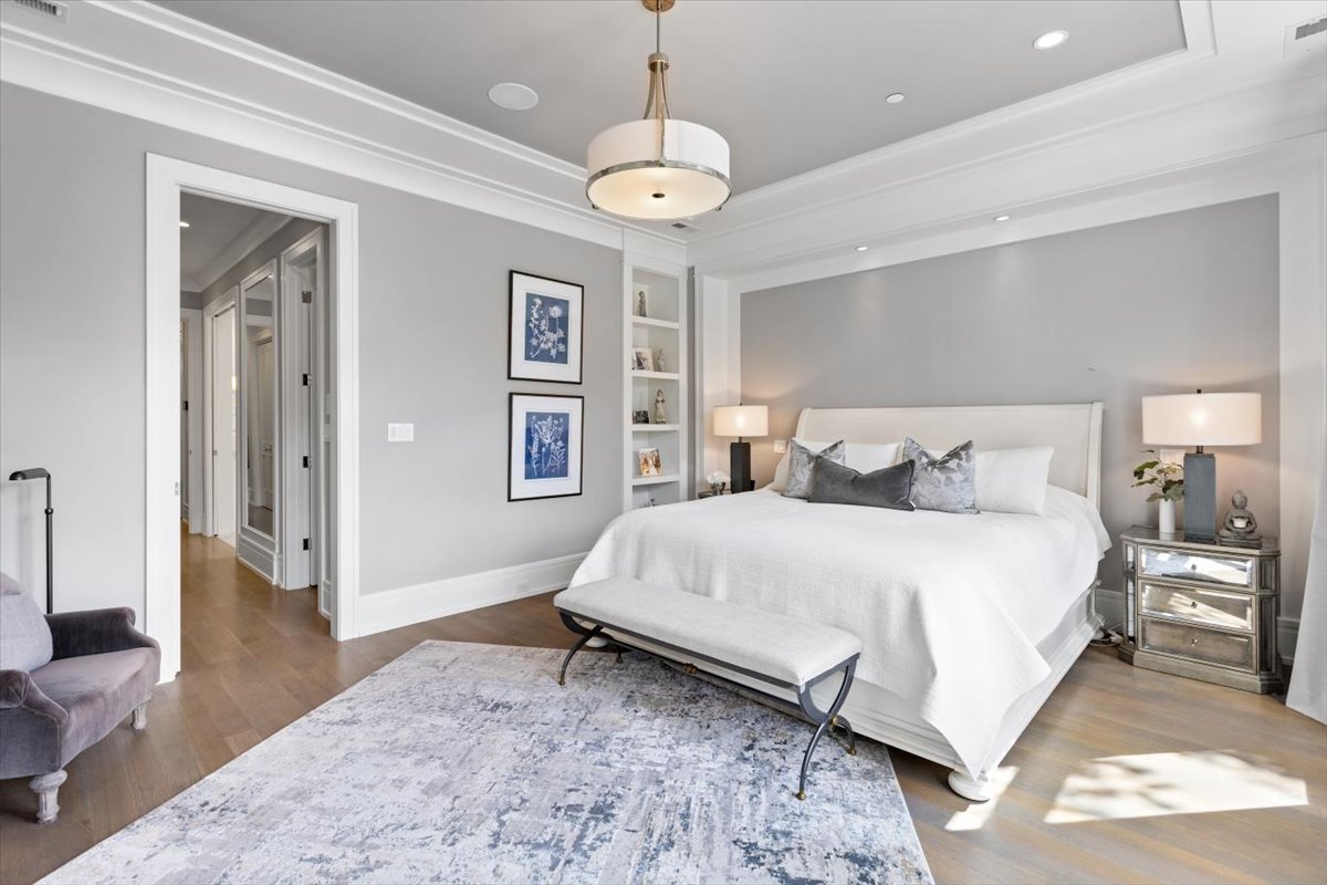 2138 North Seminary Avenue Chicago, IL 60614 - Photo 34 of 76 a bedroom with a bed and a chandelier