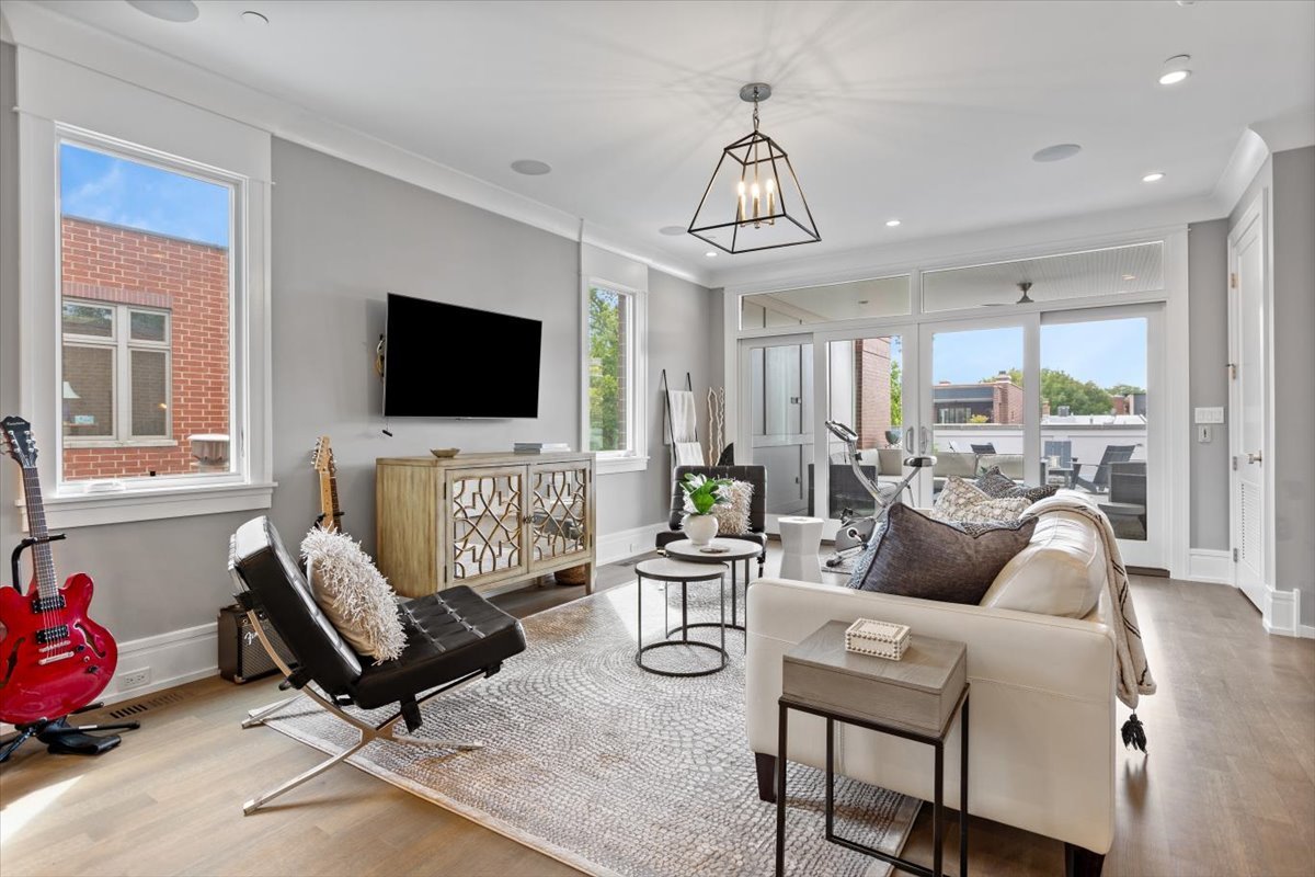 2138 North Seminary Avenue Chicago, IL 60614 - Photo 41 of 76 a living room with furniture a flat screen tv and a window