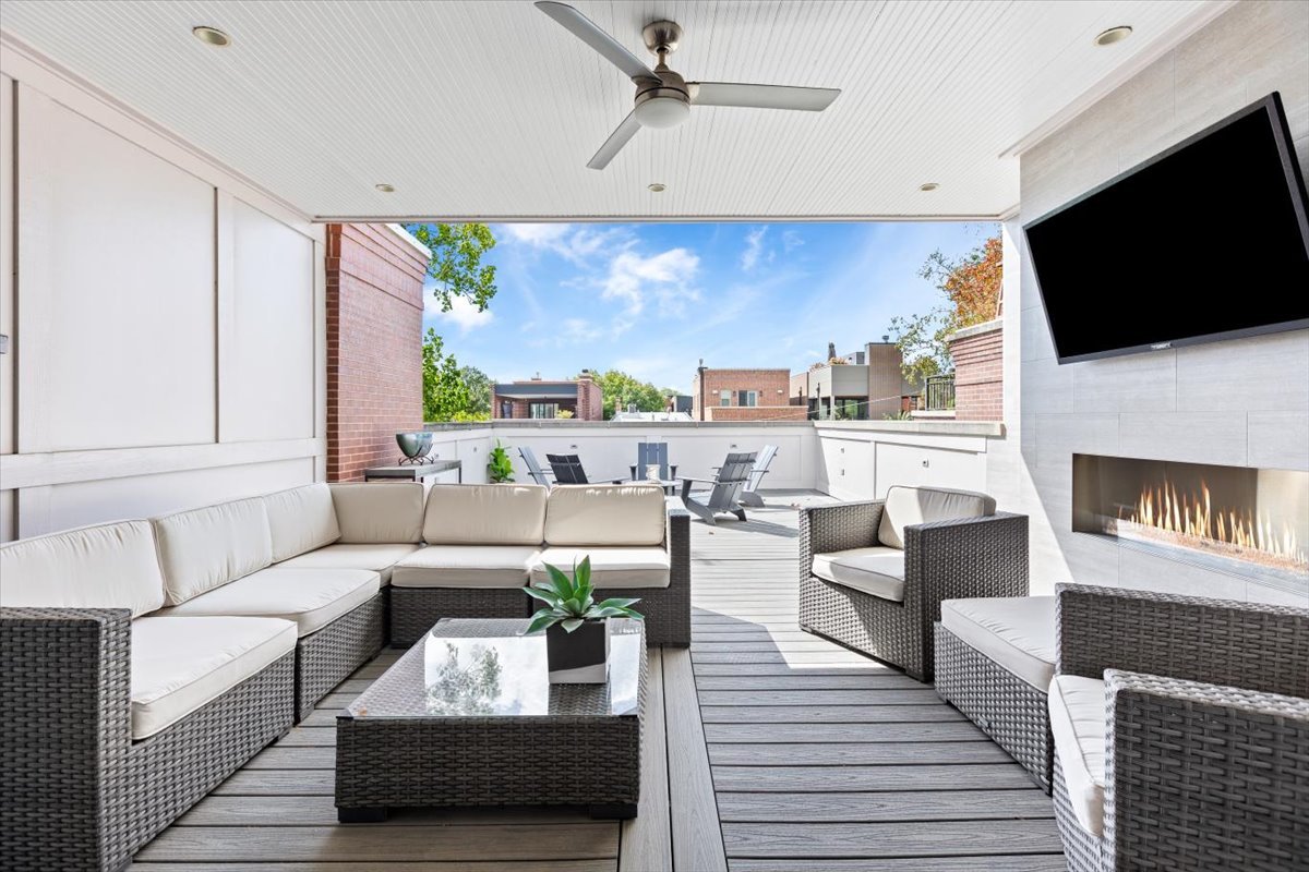 2138 North Seminary Avenue Chicago, IL 60614 - Photo 47 of 76 a living room with furniture fireplace and a flat screen tv