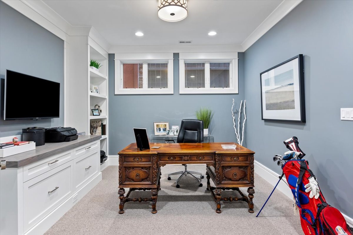 2138 North Seminary Avenue Chicago, IL 60614 - Photo 57 of 76 a view of a workspace with furniture and a flat screen tv