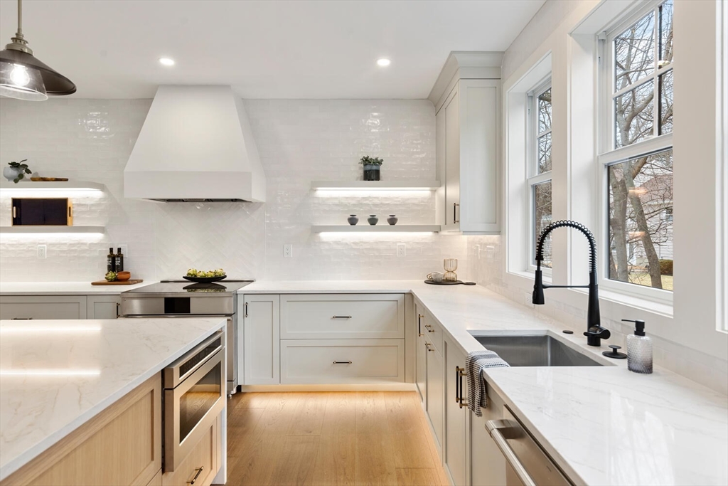 16 Estabrook Road Lexington, MA 02421 - Photo 11 of 38 a kitchen with a sink stove and cabinets