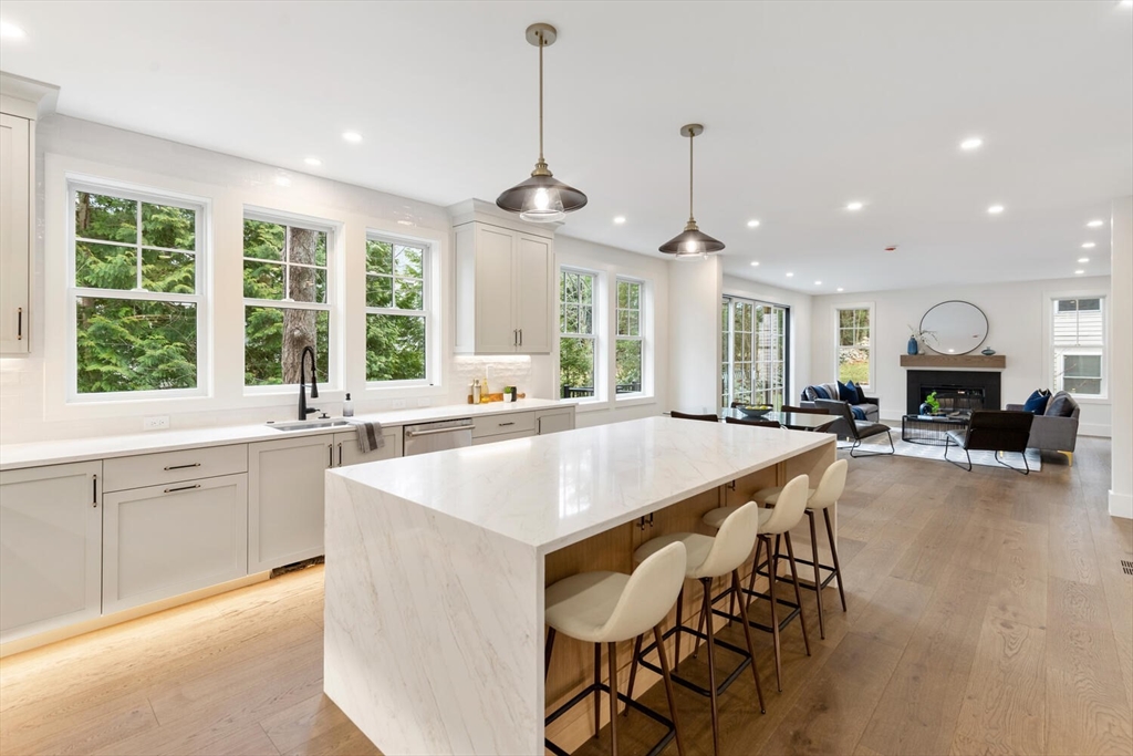 16 Estabrook Road Lexington, MA 02421 - Photo 12 of 38 a large kitchen with kitchen island a large window and chairs