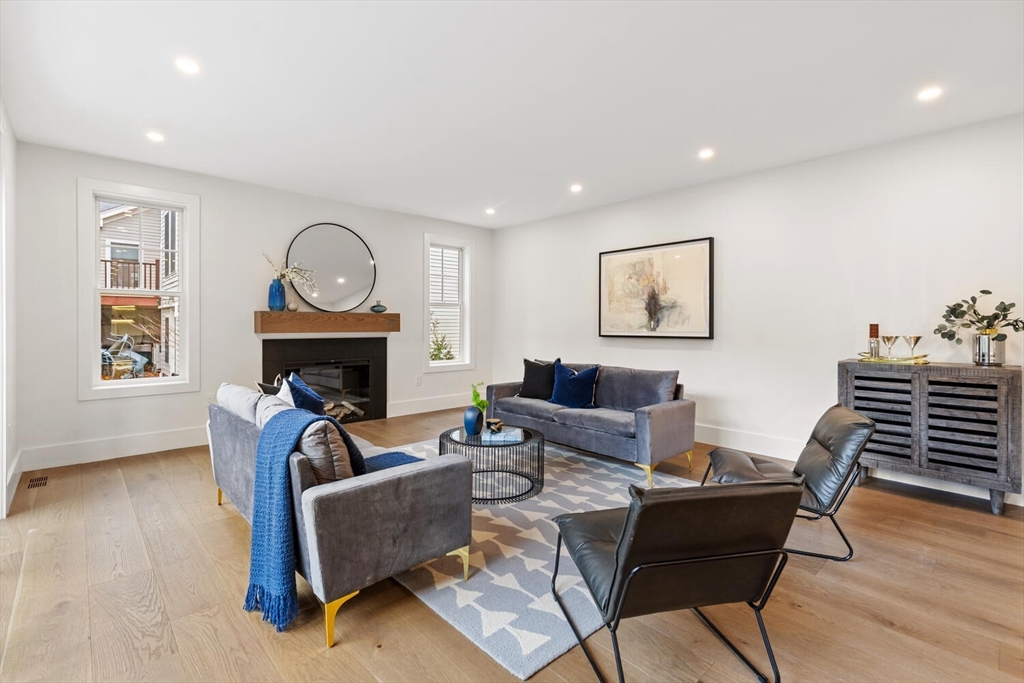 16 Estabrook Road Lexington, MA 02421 - Photo 15 of 38 a living room with furniture a fireplace and a window