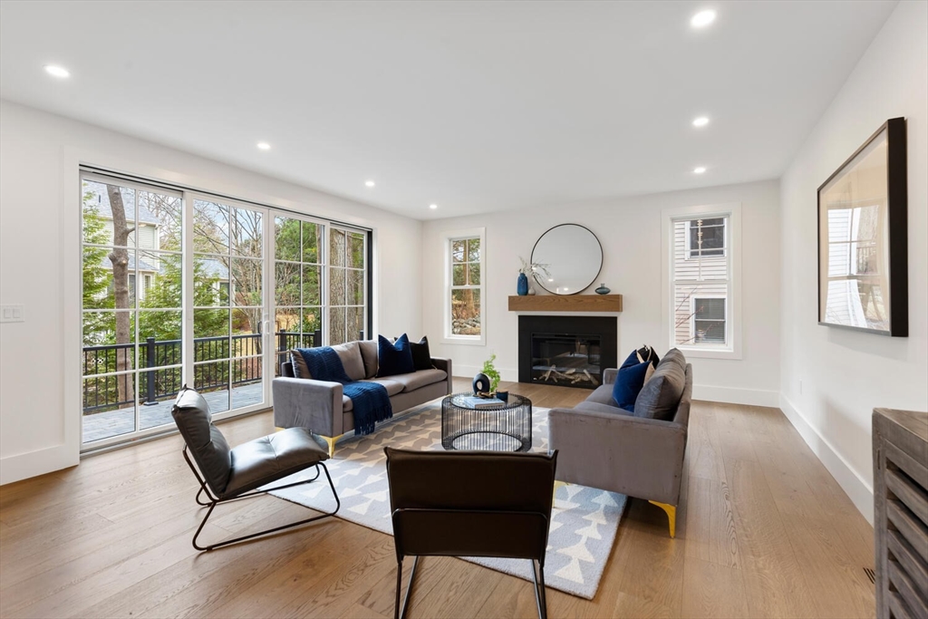 16 Estabrook Road Lexington, MA 02421 - Photo 16 of 38 a living room with furniture and a fireplace