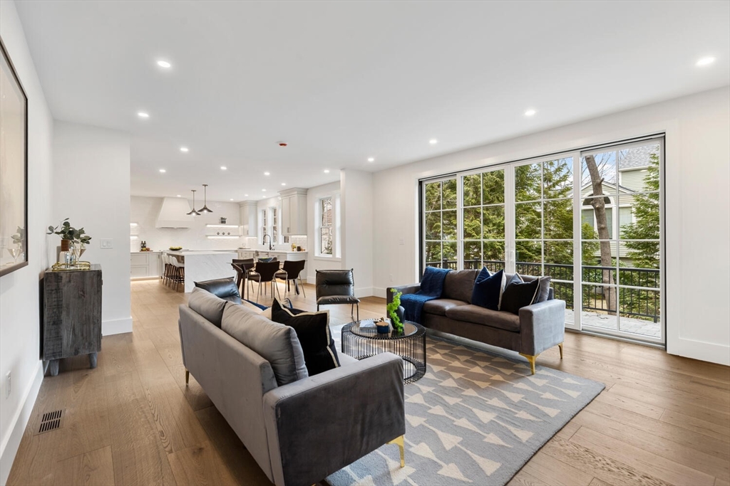 16 Estabrook Road Lexington, MA 02421 - Photo 17 of 38 a living room with furniture and a large window