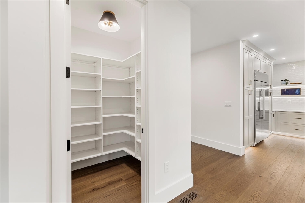 16 Estabrook Road Lexington, MA 02421 - Photo 18 of 38 a view of a room with wooden floor and cabinet