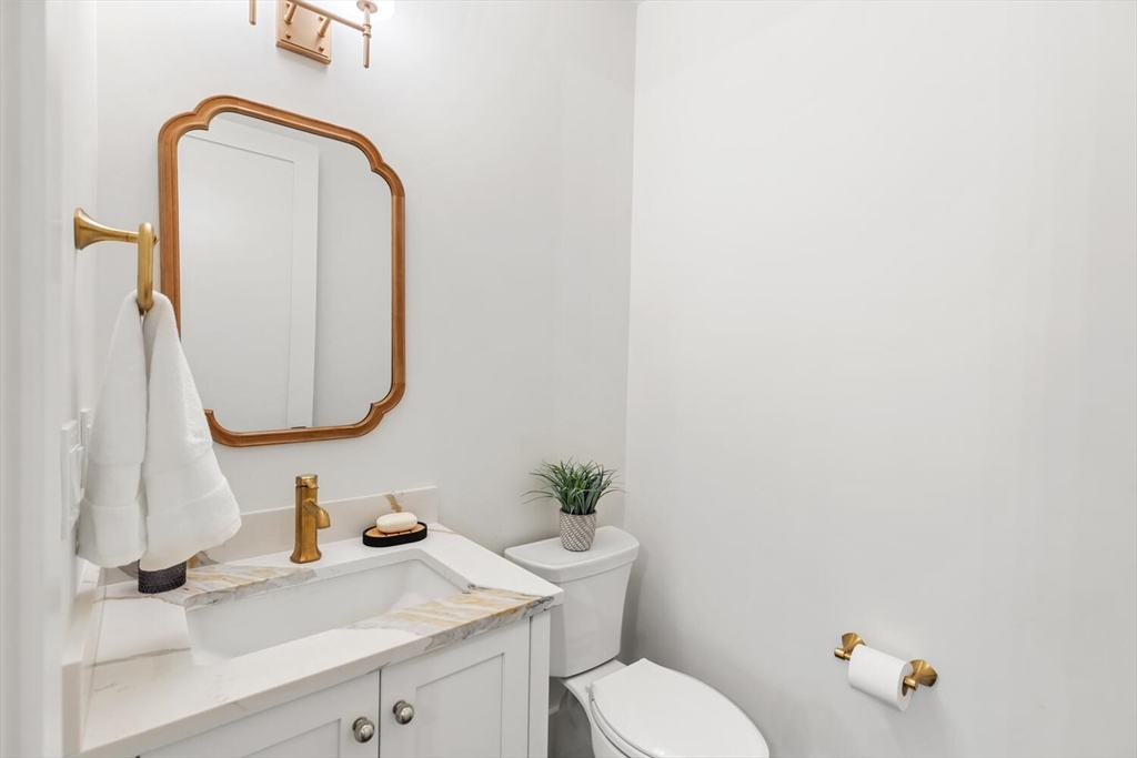 16 Estabrook Road Lexington, MA 02421 - Photo 20 of 38 a bathroom with a sink vanity mirror and toilet