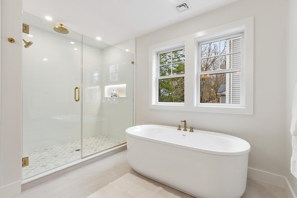16 Estabrook Road Lexington, MA 02421 - Photo 26 of 38 a white bath tub sitting next to a window