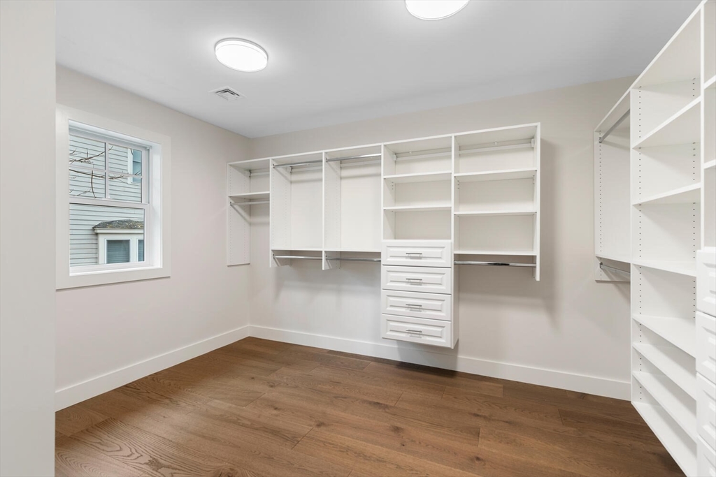 16 Estabrook Road Lexington, MA 02421 - Photo 27 of 38 an empty room with cabinet and a window