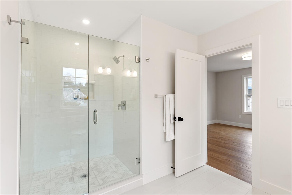 16 Estabrook Road Lexington, MA 02421 - Photo 30 of 38 a bathroom with a shower and a glass door