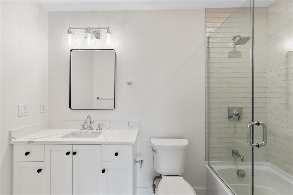 16 Estabrook Road Lexington, MA 02421 - Photo 32 of 38 a bathroom with a toilet sink shower and mirror