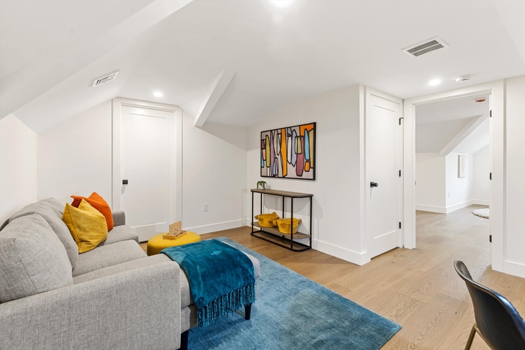 16 Estabrook Road Lexington, MA 02421 - Photo 34 of 38 a bedroom with furniture and a couch