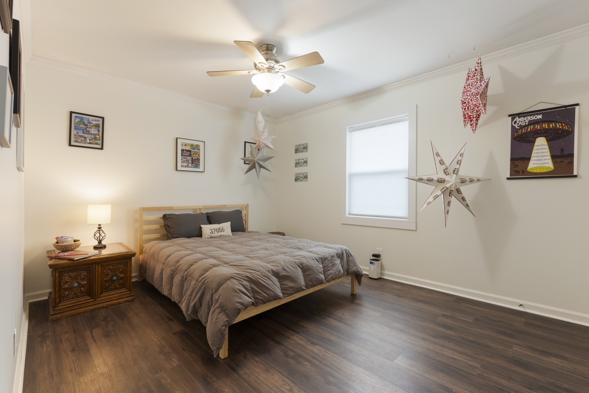 741 Fox Ridge Drive Brentwood, TN 37027 - Photo 30 of 38 a bedroom with a bed and a chandelier