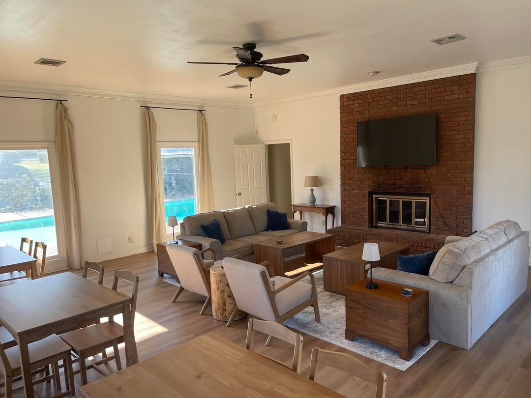 741 Fox Ridge Drive Brentwood, TN 37027 - Photo 38 of 38 a living room with furniture a fireplace and a flat screen tv