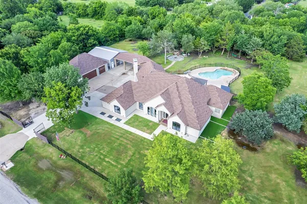 an aerial view of a house with a garden