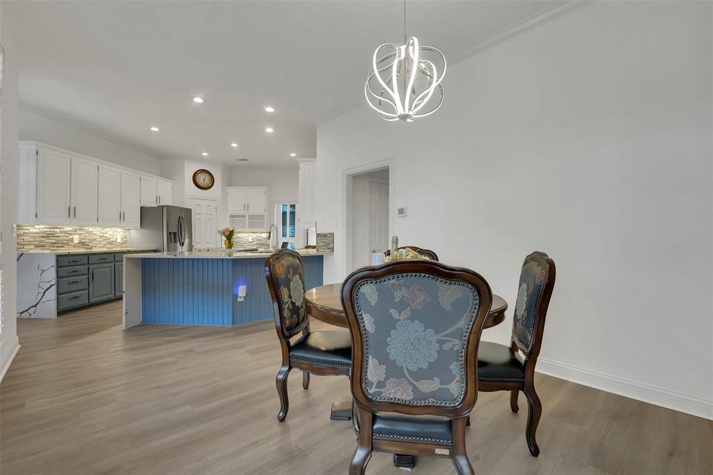 1690 Lynn Lane Lucas, TX 75002 - Photo 11 of 40 a view of a dining room with furniture and chandelier