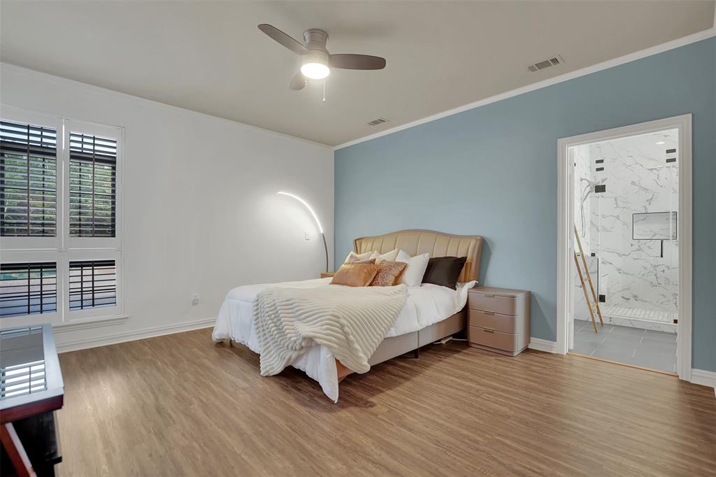 1690 Lynn Lane Lucas, TX 75002 - Photo 17 of 40 a bedroom with a bed and wooden floor