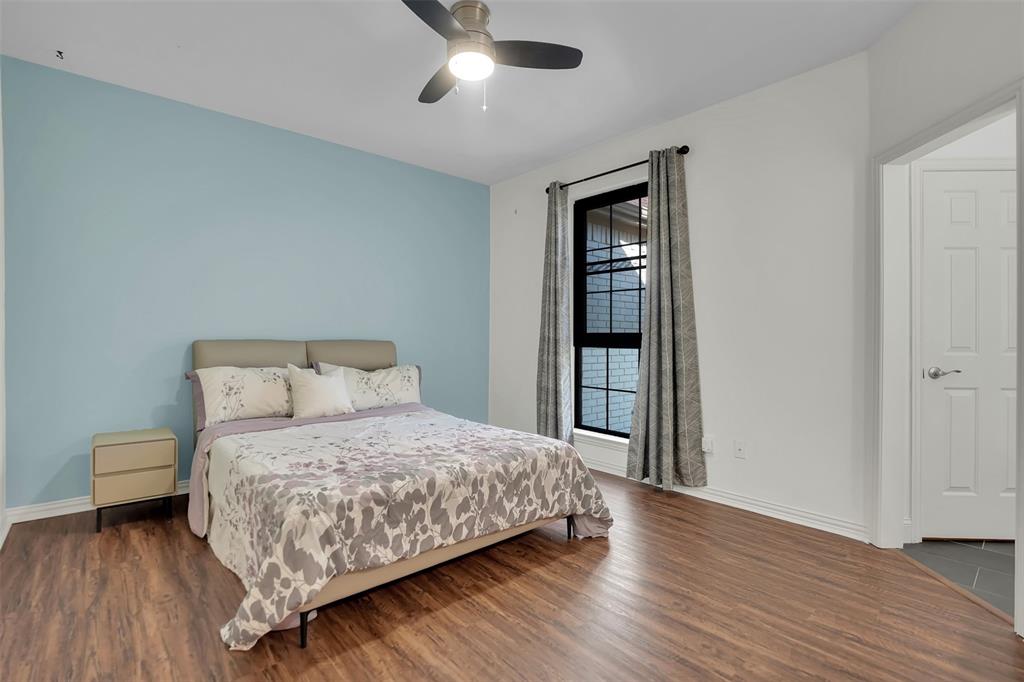1690 Lynn Lane Lucas, TX 75002 - Photo 29 of 40 a bedroom with a bed and a table