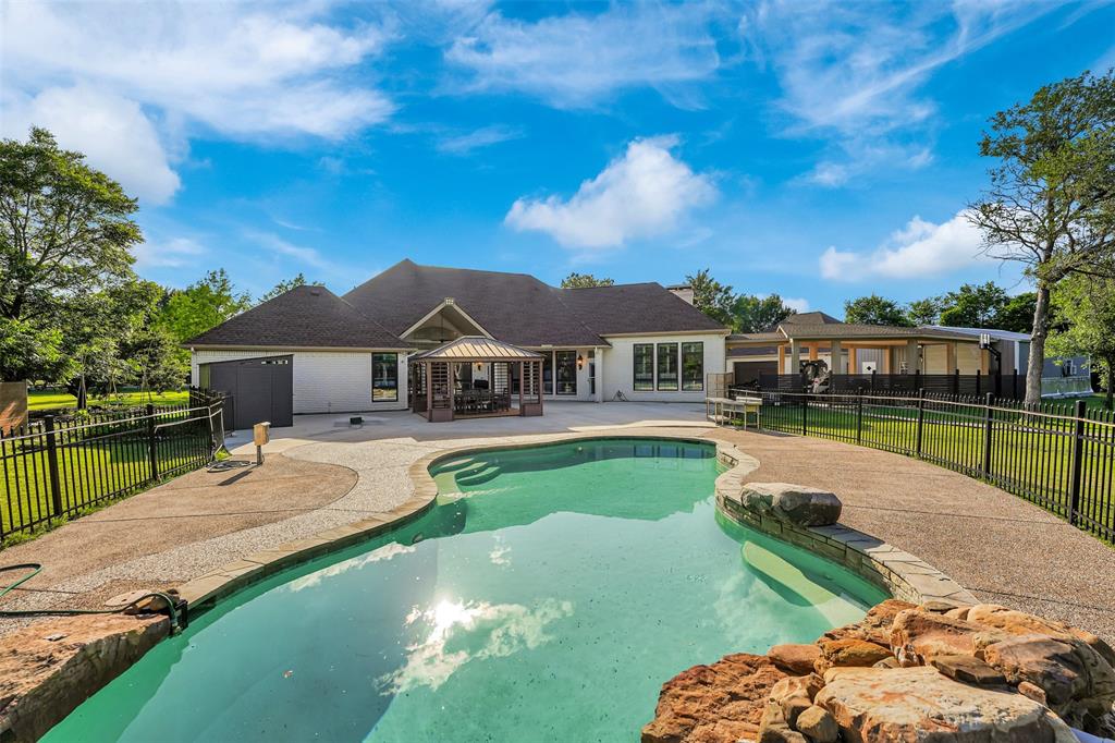 1690 Lynn Lane Lucas, TX 75002 - Photo 35 of 40 a house with swimming pool in front of it