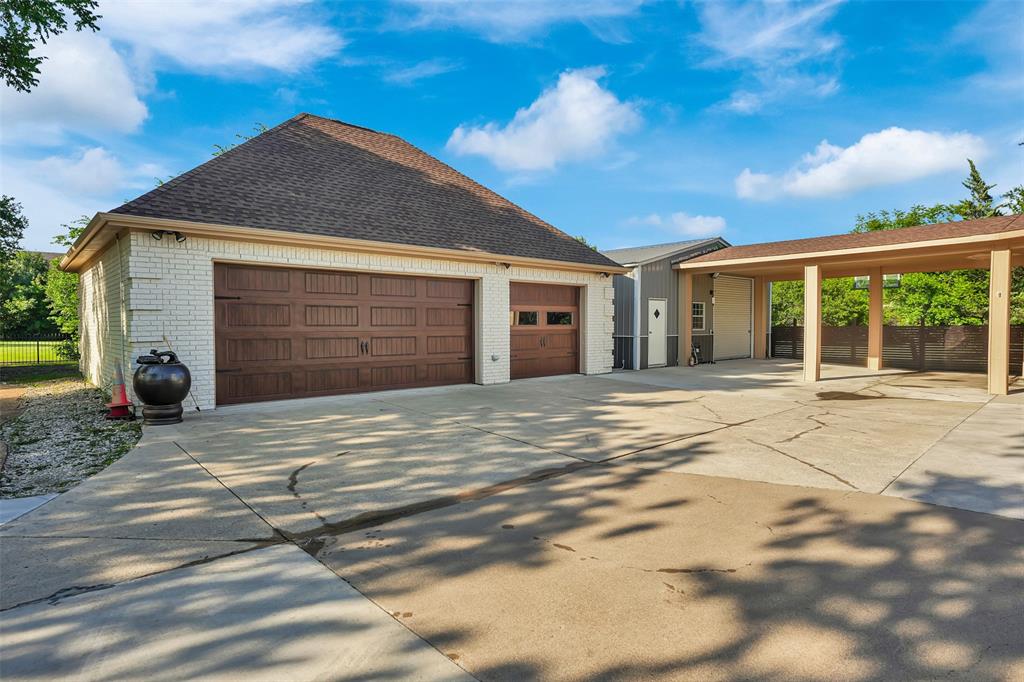 1690 Lynn Lane Lucas, TX 75002 - Photo 4 of 40 a front view of a house with a yard and garage