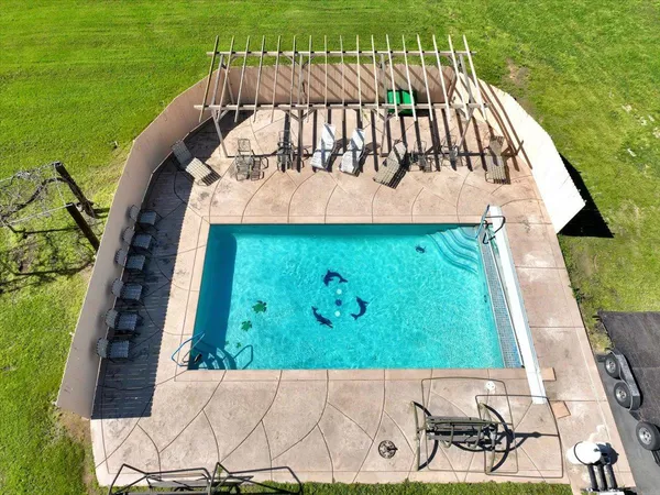 a view of swimming pool with a yard