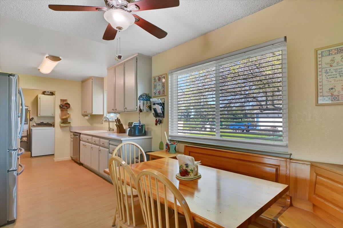 1741 U Street Elverta, CA 95626 - Photo 21 of 33 a open kitchen with stainless steel appliances granite countertop a stove a sink dishwasher and a refrigerator with wooden floor