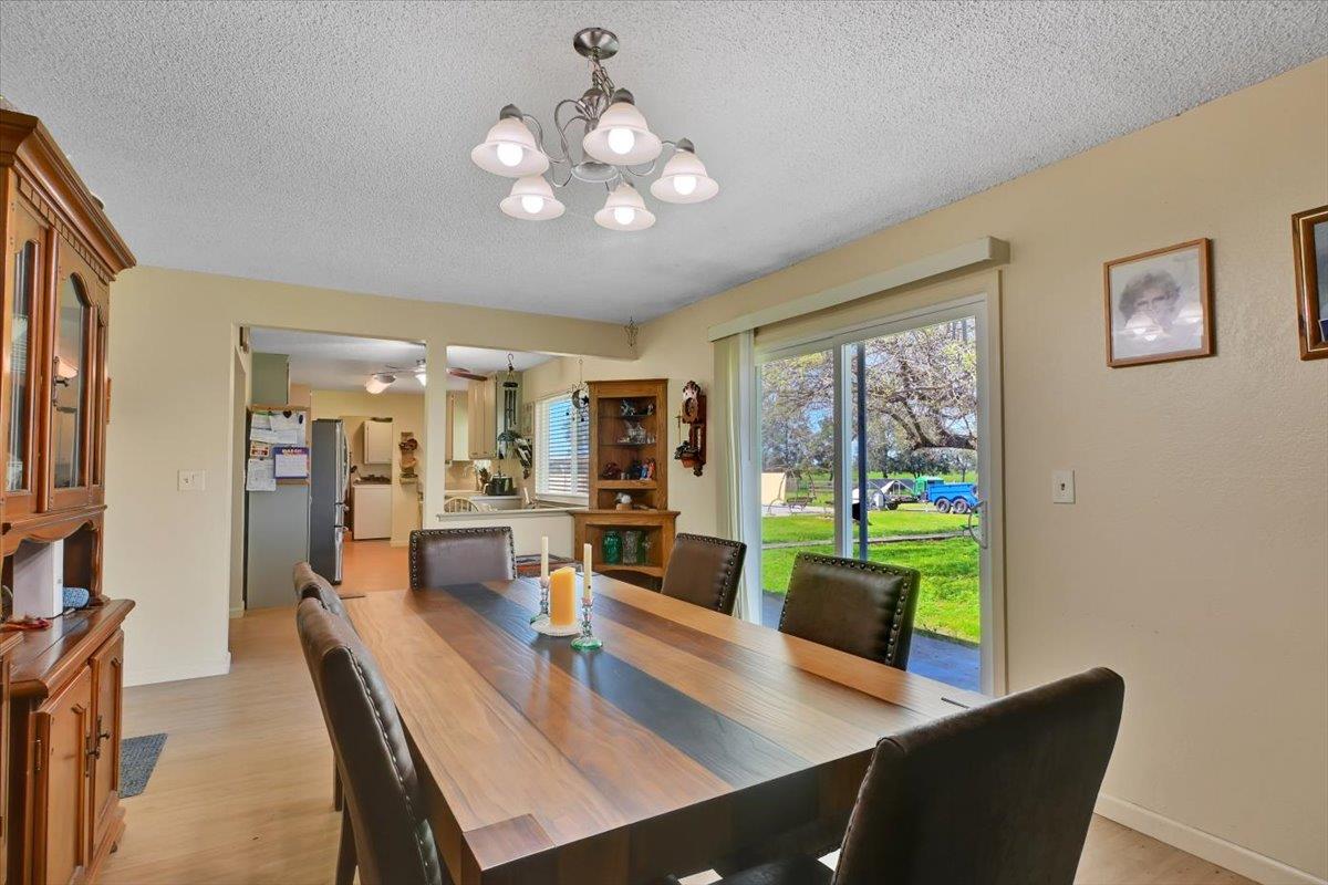1741 U Street Elverta, CA 95626 - Photo 23 of 33 a view of a dining room with furniture wooden floor and a large window