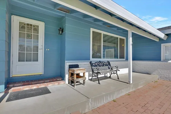 a outdoor living space with furniture and a window