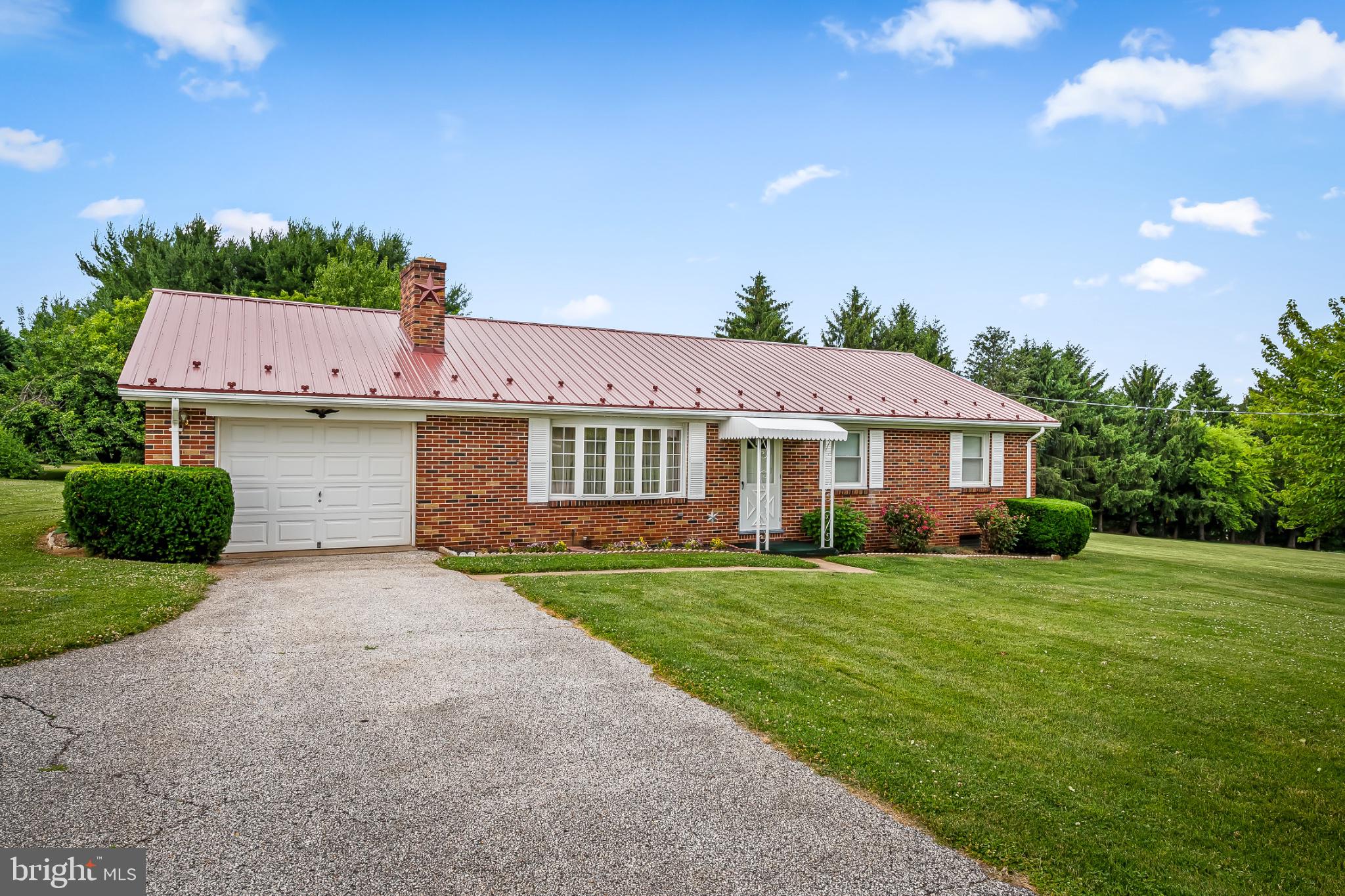 2100 Peterman Road Freeland, MD 21053 - Photo 2 of 36 Charming brick home with lush greenery.